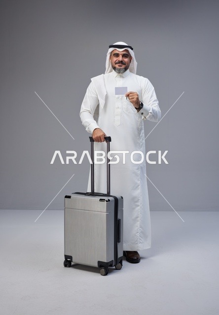 Saudi Man with Travel Suitcase and Credit Card