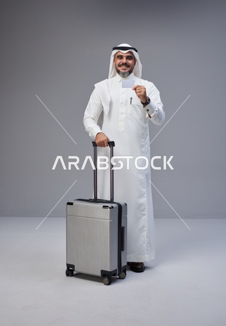 Saudi Man with Suitcase Holding Card for Travel