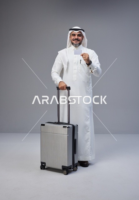 Saudi Man with Suitcase and Credit Card in Studio