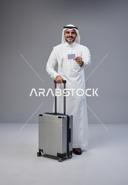Saudi Man with Suitcase and Credit Card Studio Shot