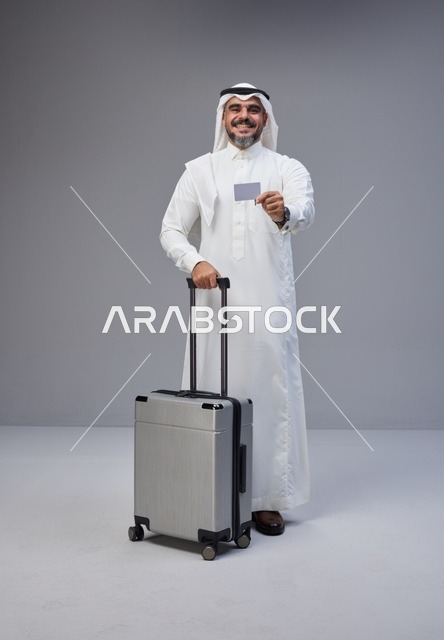 Saudi Man with Suitcase and Credit Card in Studio