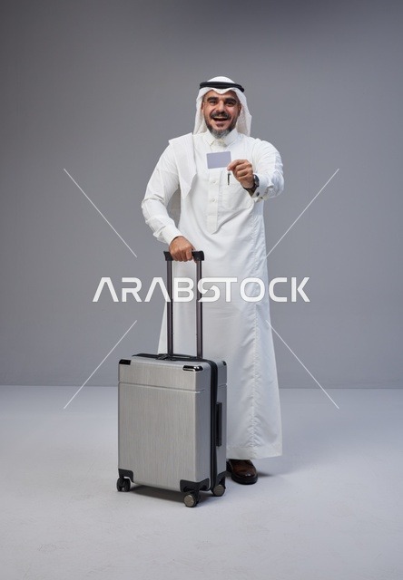 Saudi Man with Suitcase Holding Bank Card