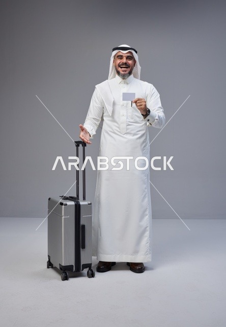 Saudi Man in Traditional Thobe with Suitcase and Card