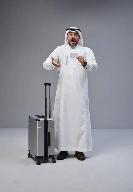 Saudi Man with Suitcase and Credit Card