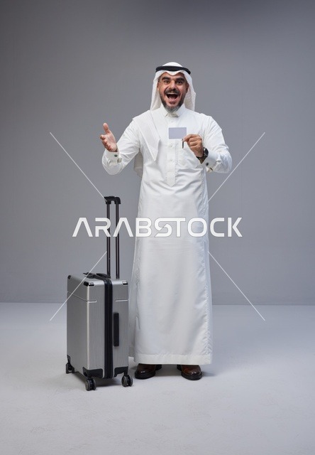 Saudi Man with Suitcase and Credit Card in Studio