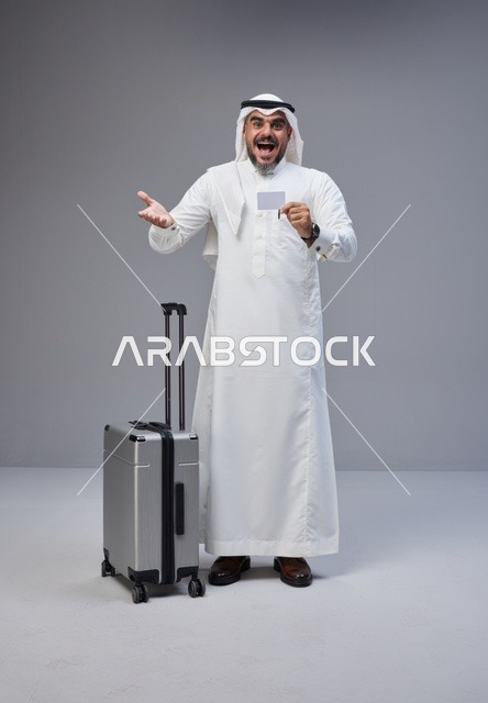 Saudi Man with Suitcase and Credit Card in Studio