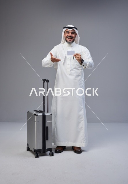 Saudi Man with Suitcase and Credit Card Studio Shot