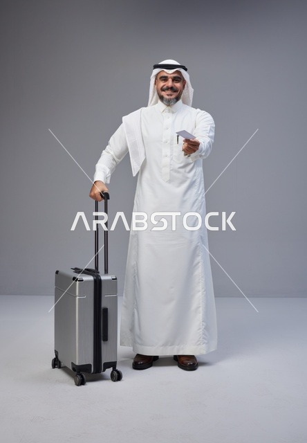 Saudi Man with Suitcase and Credit Card in Studio