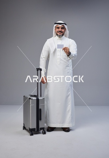Saudi Man with Suitcase Holding Blank Card
