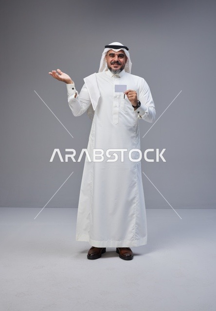 Saudi Man in Traditional Thobe Holding Blank ID Card