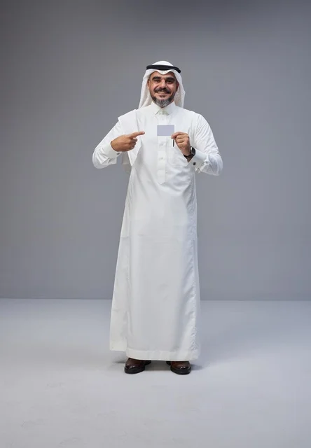 Saudi Man in Traditional Dress Holding Blank White Card