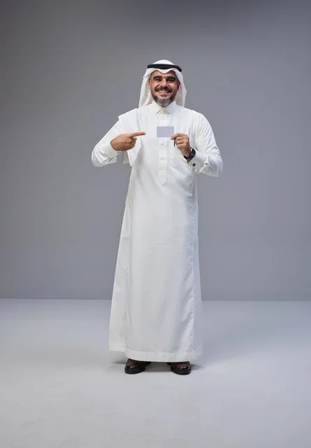 Saudi Man Holding Blank Card in Traditional Dress