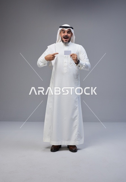 Saudi Man Holding Blank Card in Studio