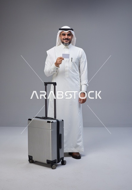 Saudi Man with Suitcase and Credit Card in Studio