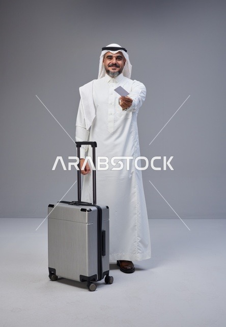 Saudi Man with Suitcase and Credit Card