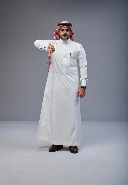 Saudi Man in Traditional Thobe Giving Thumbs Down