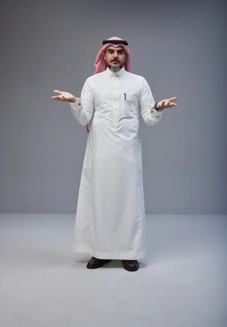 Saudi Man in Traditional Dress Gesturing in Studio
