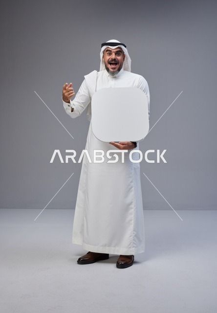 Saudi Man in Traditional Thobe Holding Blank Sign
