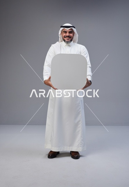 Saudi Man in Traditional Thobe Holding Blank Board