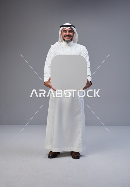 Saudi Man in Traditional Thobe Holding Blank Board