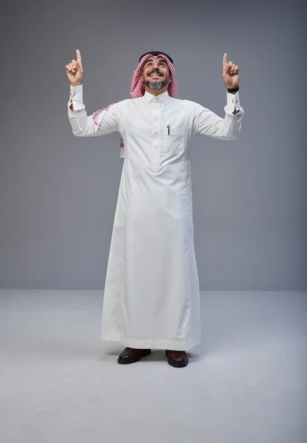 Saudi Man in Traditional Dress Pointing Upward