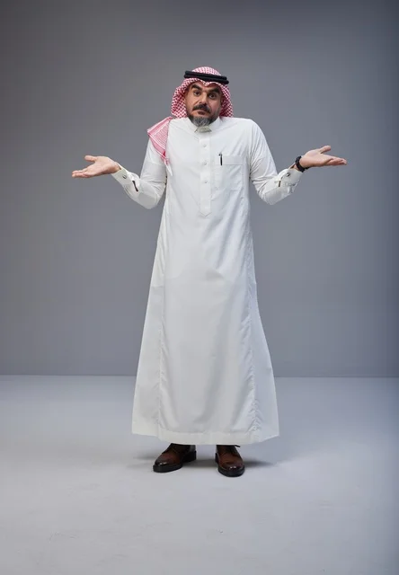 Saudi Man Shrugging in Traditional Thobe Studio Portrait