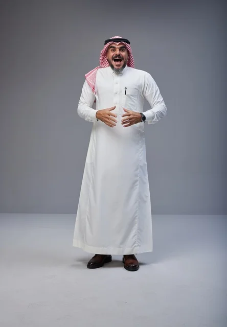Excited Saudi Man in Traditional Dress Studio Portrait
