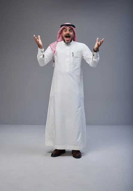 Shocked Saudi Man in Traditional Thobe on Grey Background