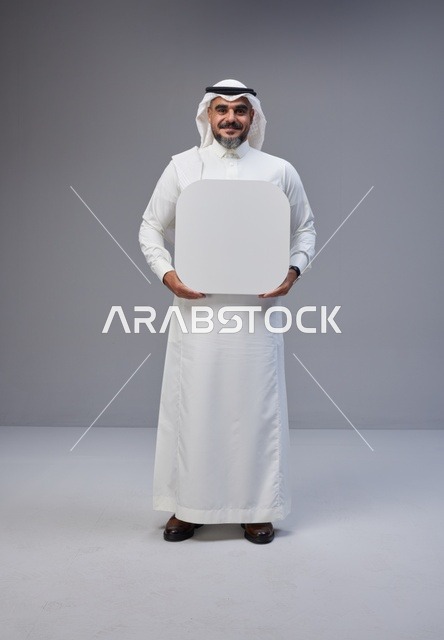 Saudi Man Holding Blank White Board in Studio
