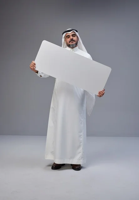 Saudi Man Holding Blank White Board in Studio