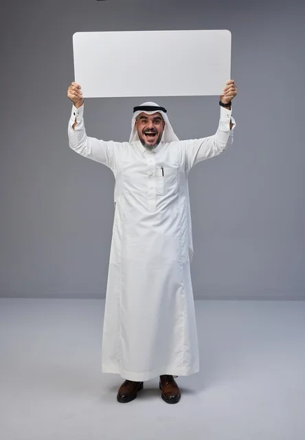 Saudi Man Holding Blank White Board in Studio Shot