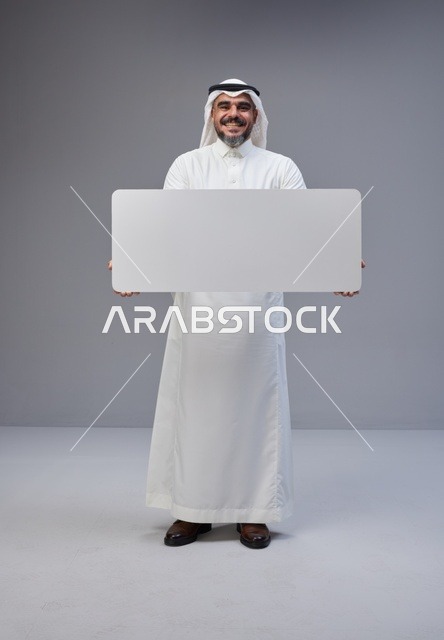 Saudi Man in Traditional Thobe Holding Blank White Sign