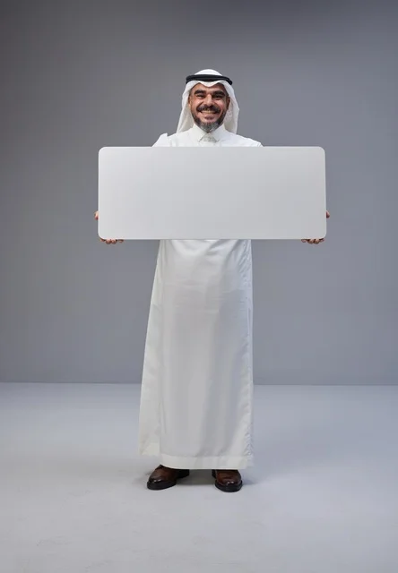 Saudi Man in Traditional Dress Holding Blank Banner