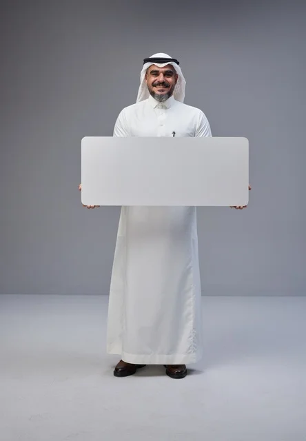 Saudi Man Holding Blank Sign in Studio