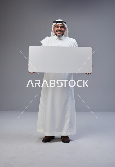 Saudi Man in Traditional Thobe Holding Blank White Board