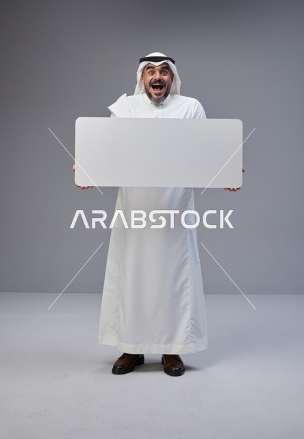 Saudi Man in Traditional Thobe Holding Blank Sign