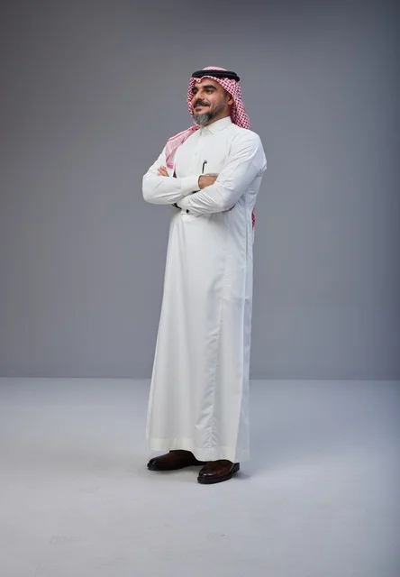 Saudi Man in Traditional Dress with Crossed Arms