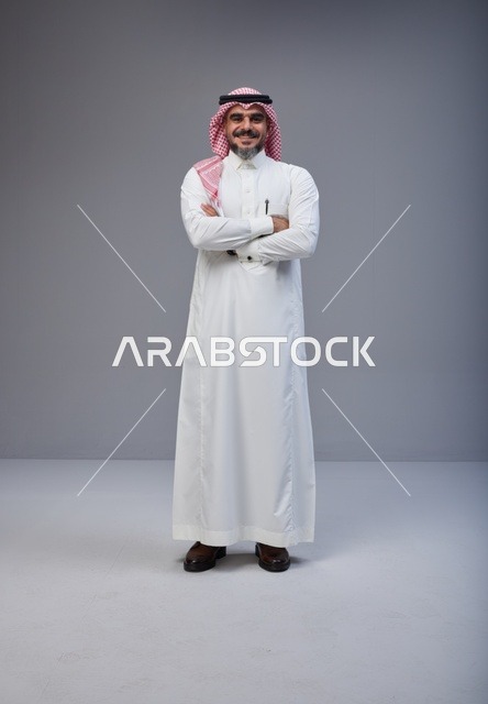 Smiling Saudi Man in Traditional Thobe Studio Portrait