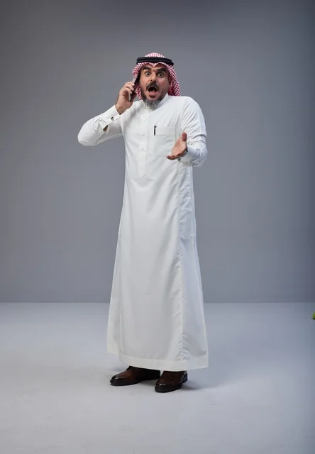 Shocked Saudi Man Using Smartphone in Studio