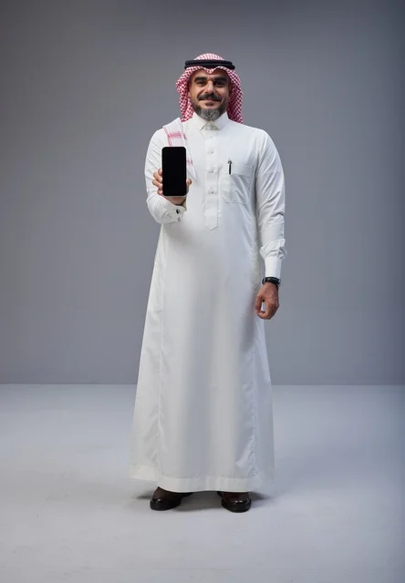 Saudi Man Holding Smartphone with Blank Screen