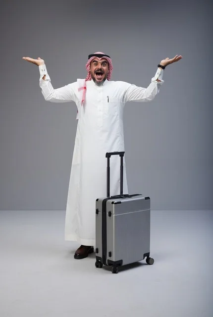 Excited Saudi Man with Suitcase in Studio