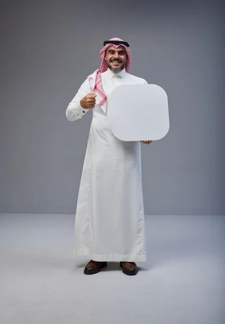 Saudi Man Holding Blank White Placard in Studio Saudi Man Holding Blank White Placard in Studio