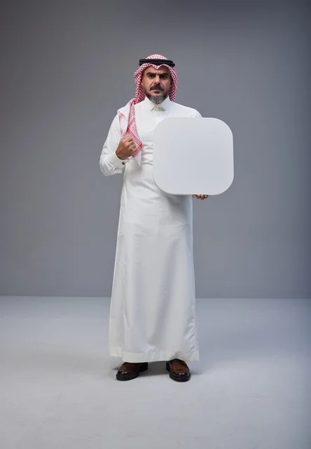 Saudi Man Holding Blank White Board in Studio