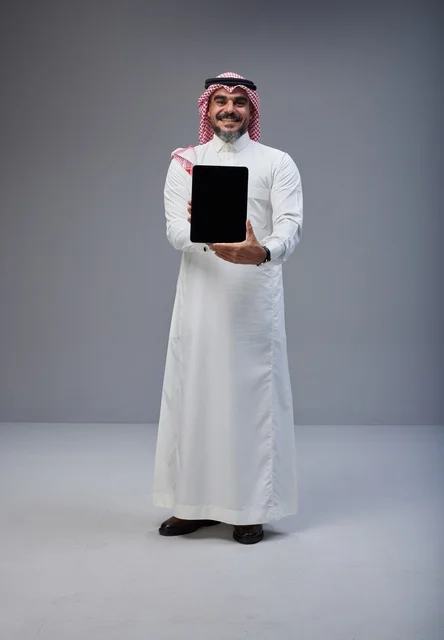 Saudi Man Holding Blank Tablet Screen in Studio
