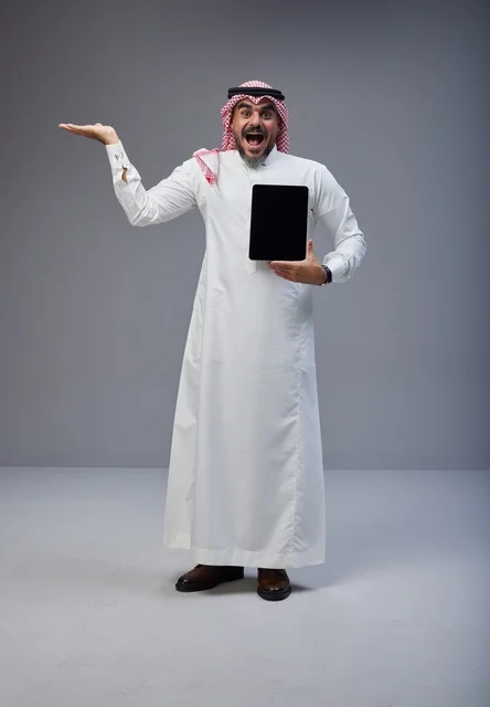 Excited Saudi Man Holding Digital Tablet with Blank Screen