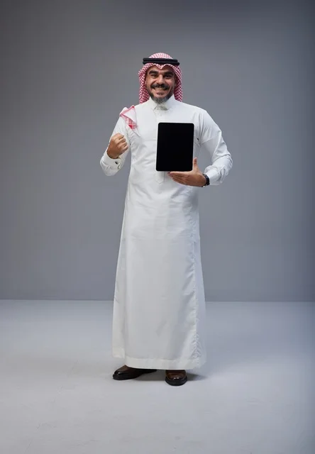 Saudi Man Holding Tablet Blank Screen in Studio