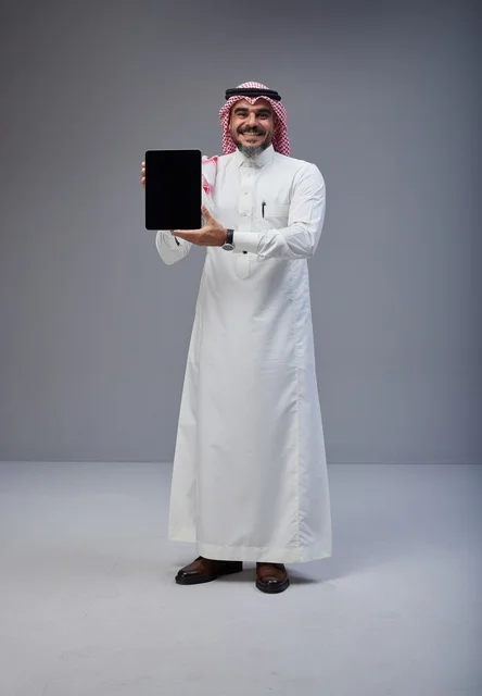 Saudi Man Holding Blank Tablet Screen in Studio