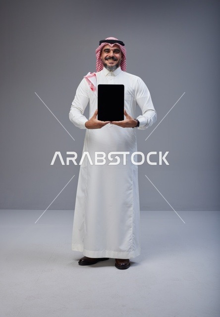 Saudi Man Holding Tablet Blank Screen Studio Shot