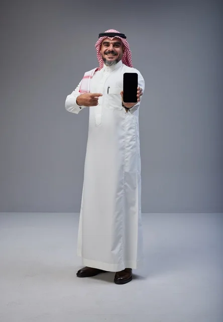 Saudi Man Pointing at Blank Smartphone Screen