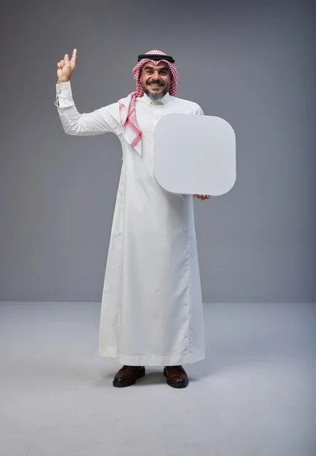 Saudi Man Holding Blank White Sign in Studio